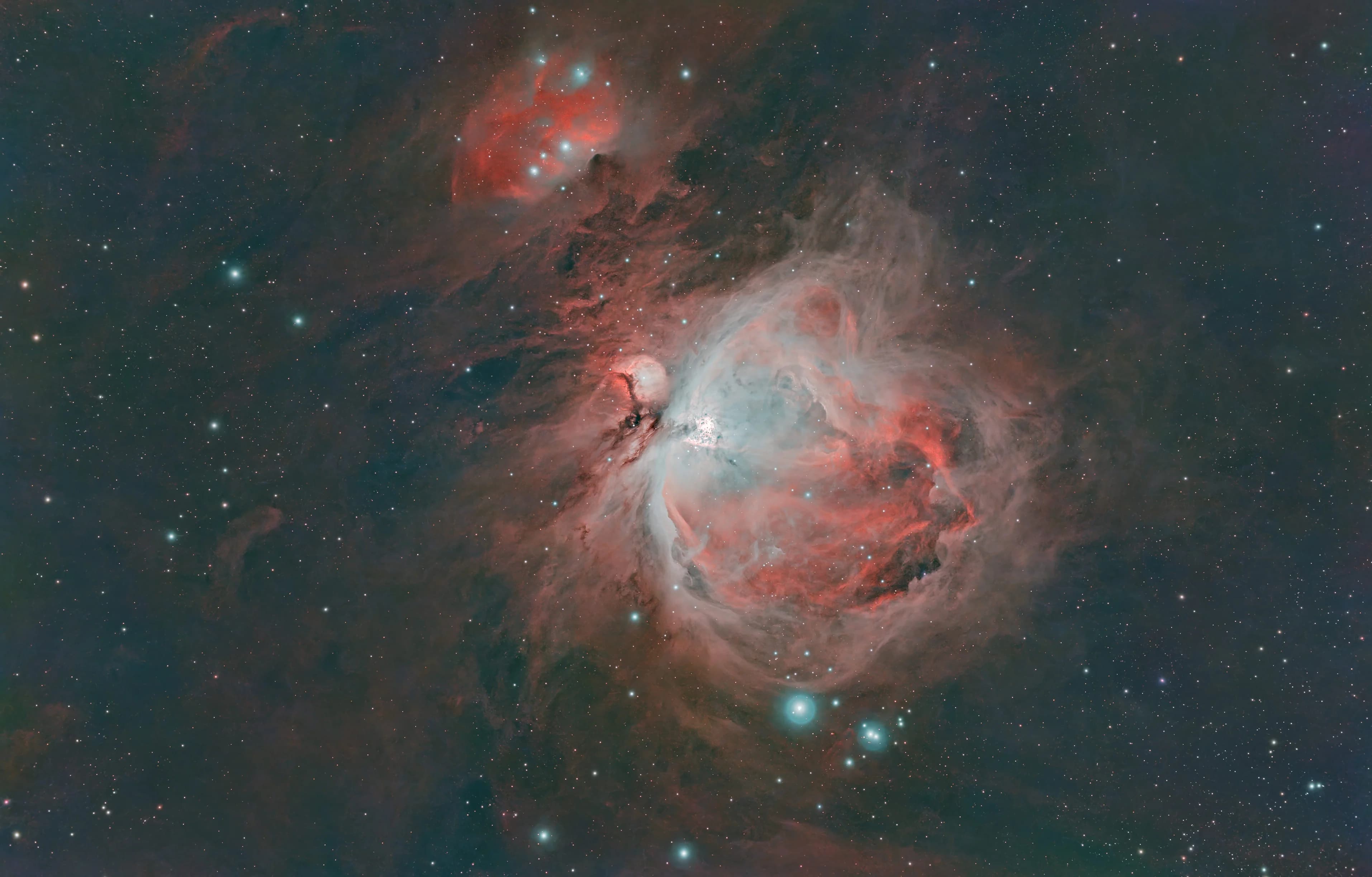 The Orion Nebula (M42) and the Running Man Nebula (NGC 1977) showing deep dust structures.