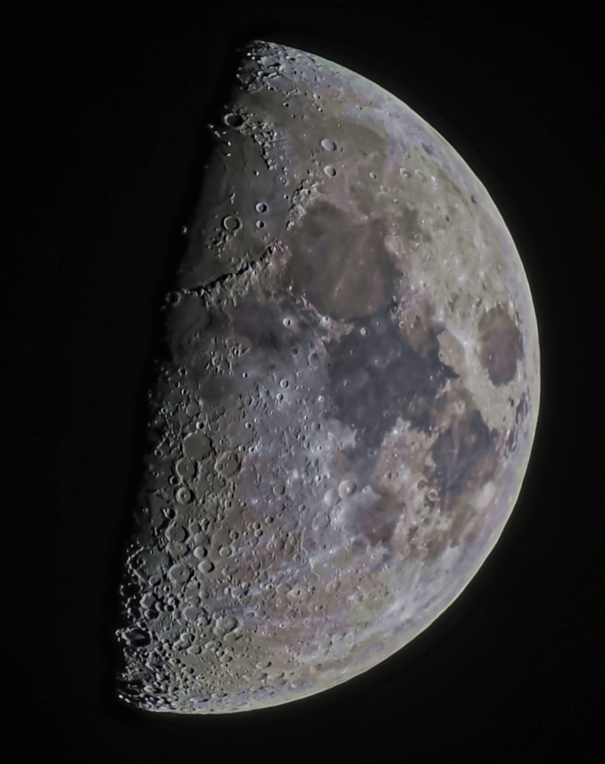 A high-resolution half moon captured with a Nikon Z8 and 500mm lens, showing stark crater relief along the terminator.