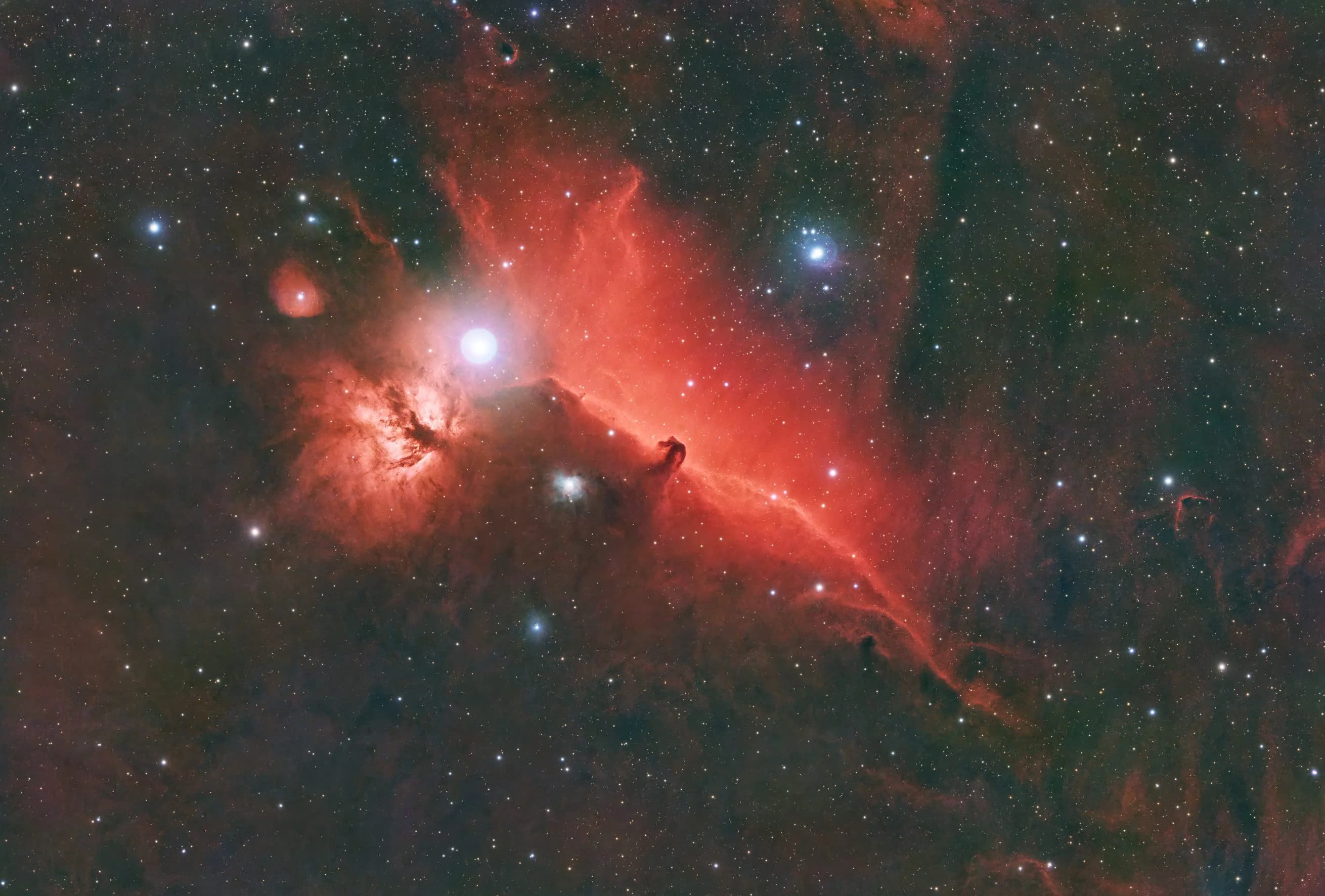 The Horsehead Nebula (Barnard 33) and the Flame Nebula (NGC 2024) in the Orion Molecular Cloud Complex.