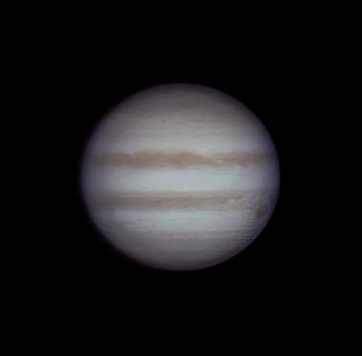 The planet Jupiter showing distinct equatorial bands.