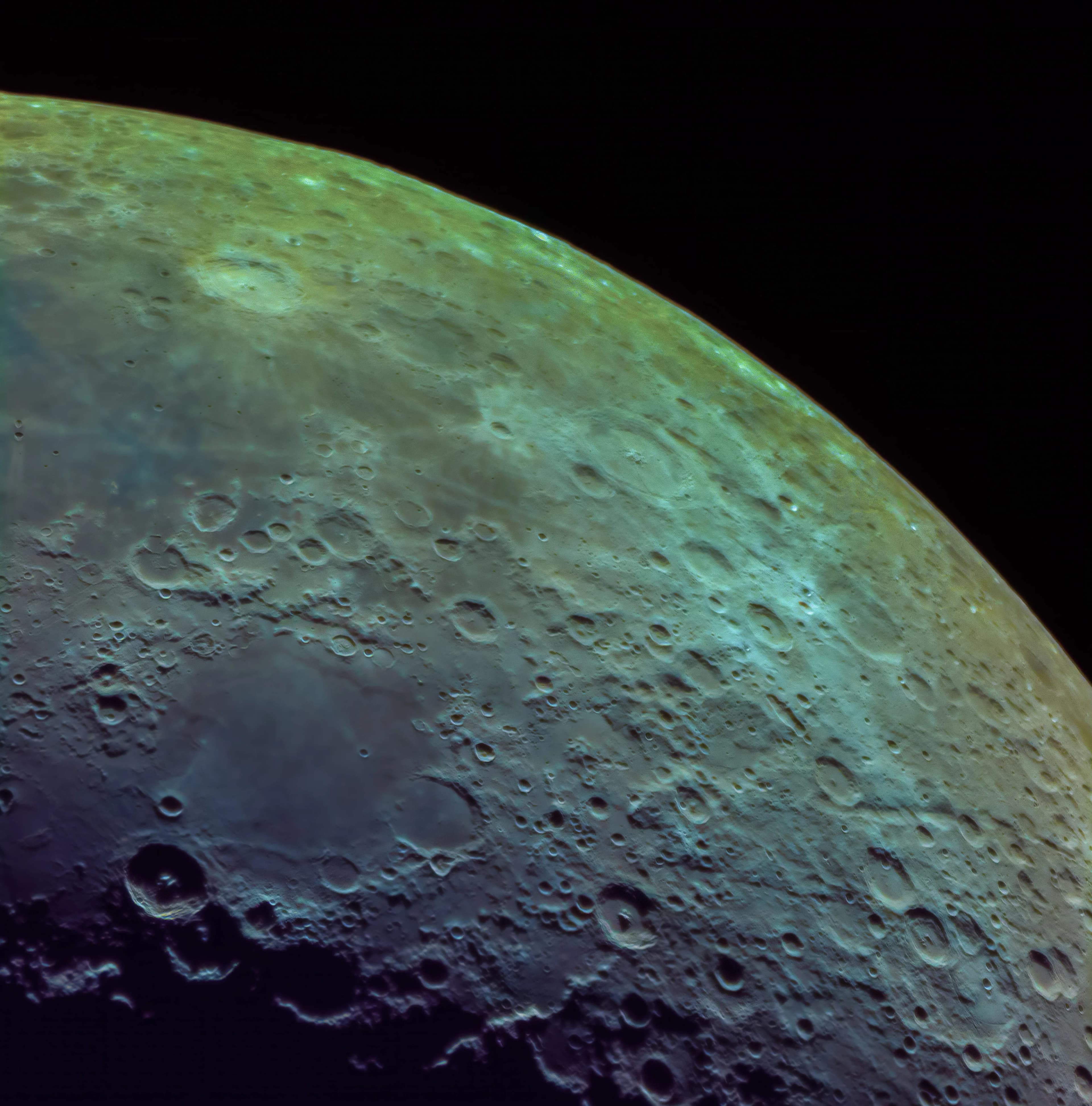 Detailed mineral moon crop showing heavily cratered highlands and varied geological color compositions.