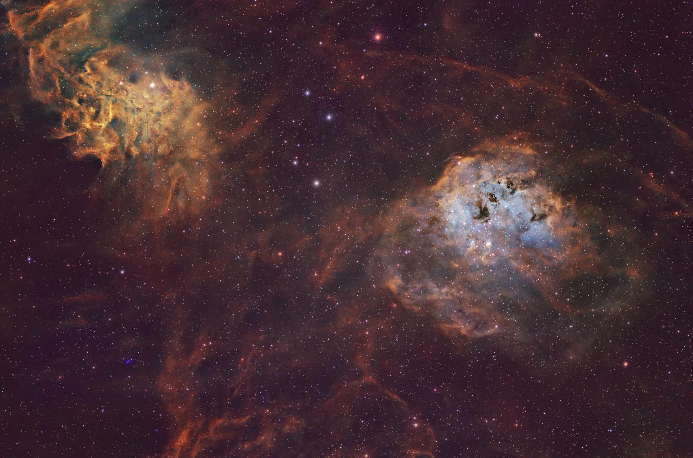 A 34.5-hour SHO narrowband astrophotography widefield view of the Auriga molecular cloud, featuring the Flaming Star Nebula (IC 405) and the Tadpoles Nebula (IC 410).