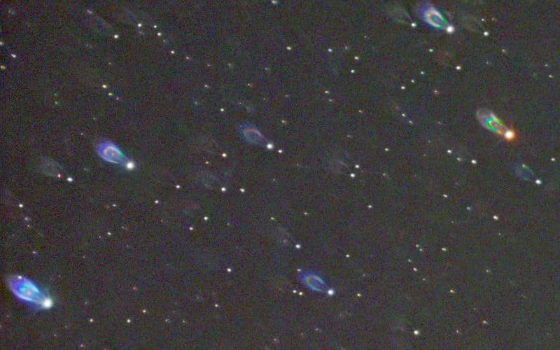 1:1 crop from the bottom-right corner of the IC 443 field showing comet-shaped stars caused by backfocus error and sensor tilt