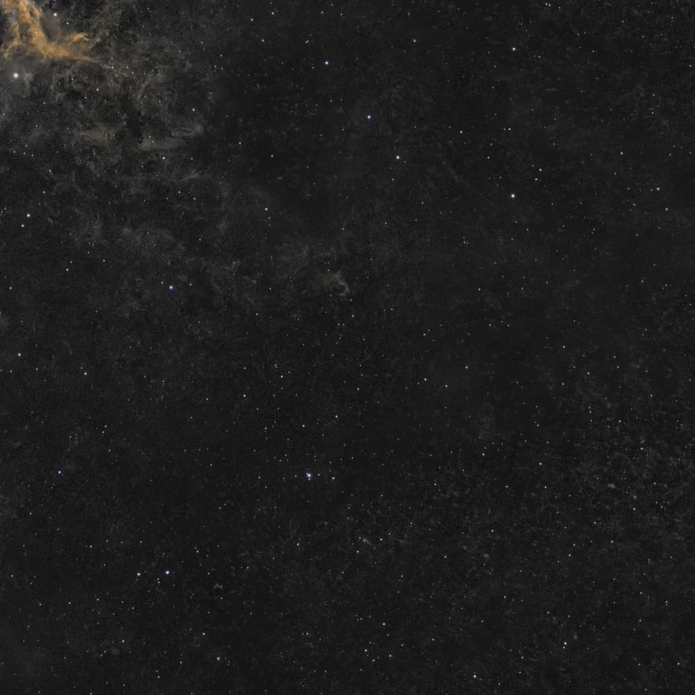 Right-hand sky of the IC 443 frame, before and after removing worm-like streaks left by backfocus comet stars - After