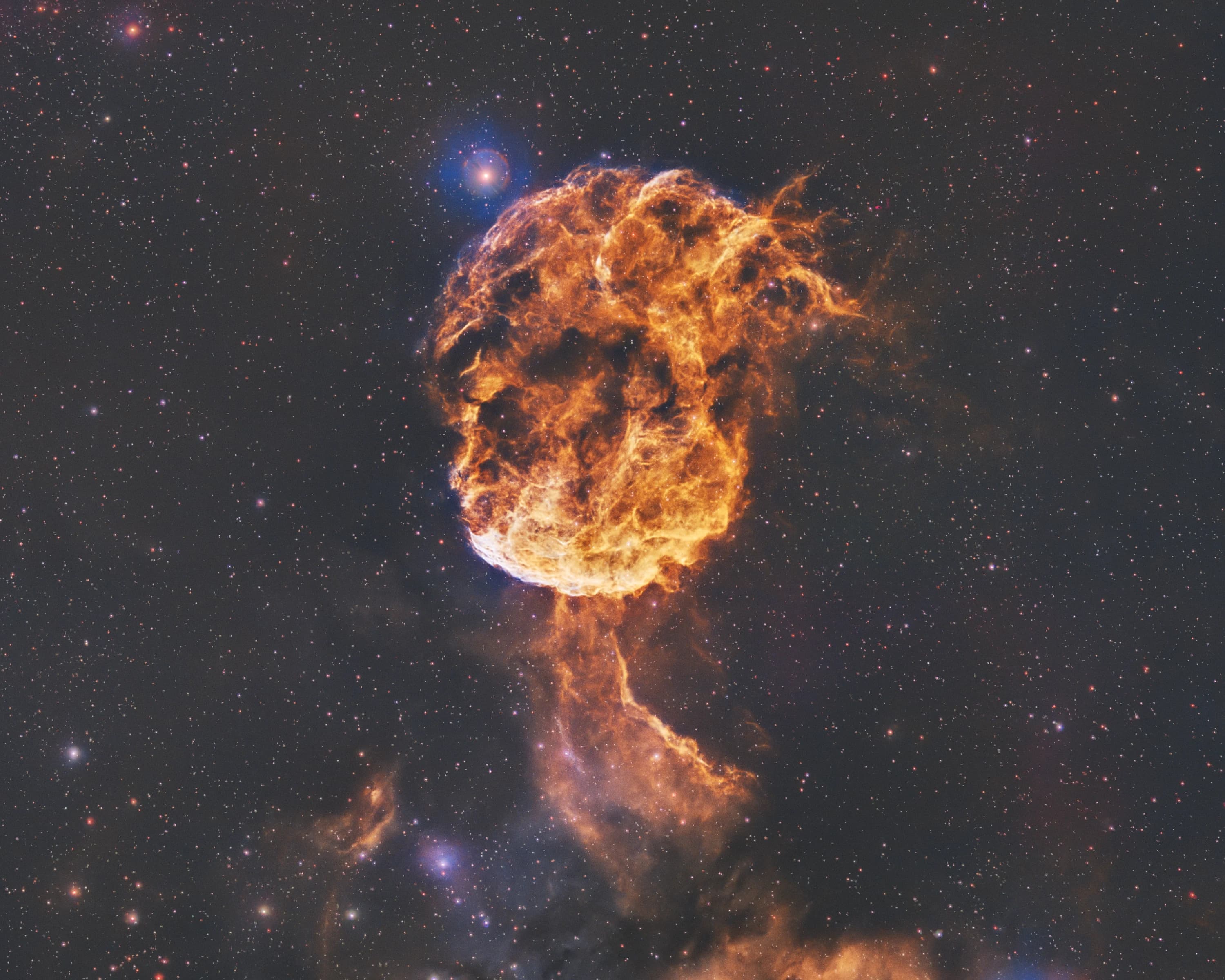 My earlier hand-processed SHO image of the Jellyfish Nebula (IC 443), with a warm gold shell and cyan oxygen accents